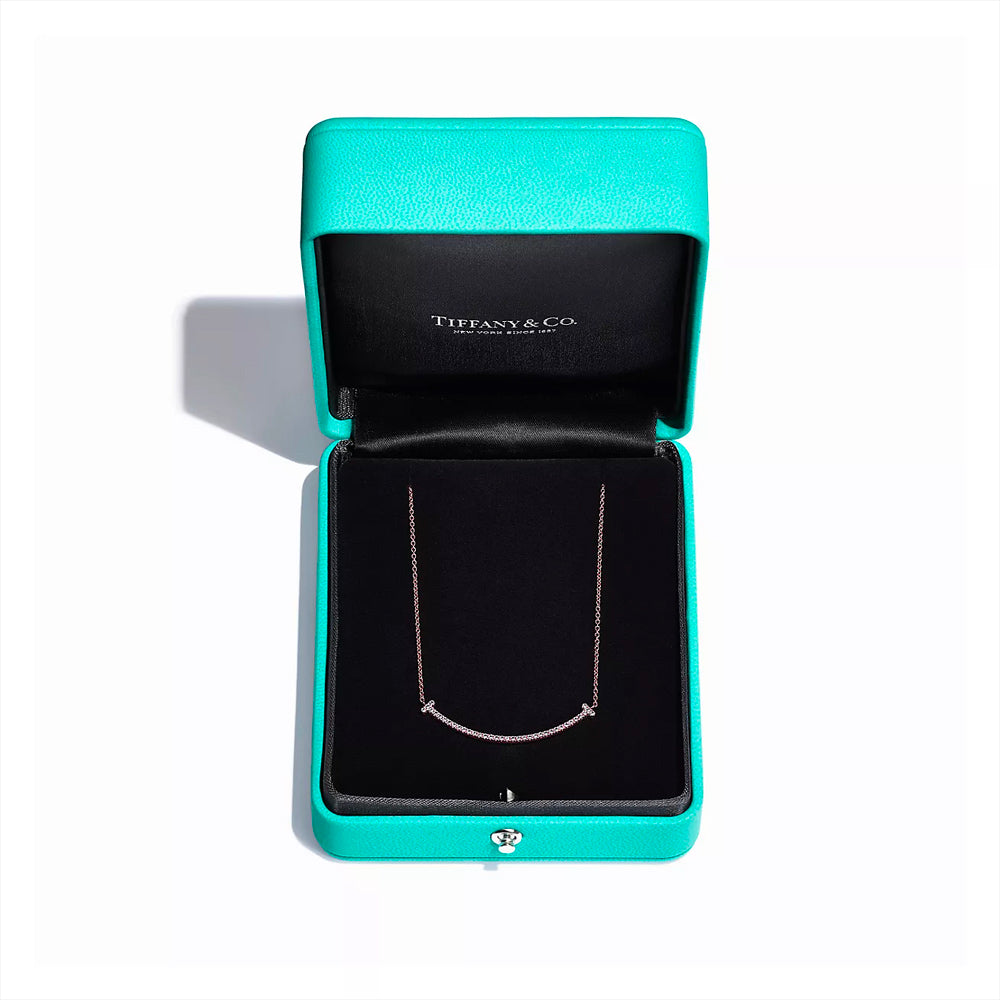 Tiffany T smile pendant in 18k rose gold with diamonds, mini. | Tiffany & Co .