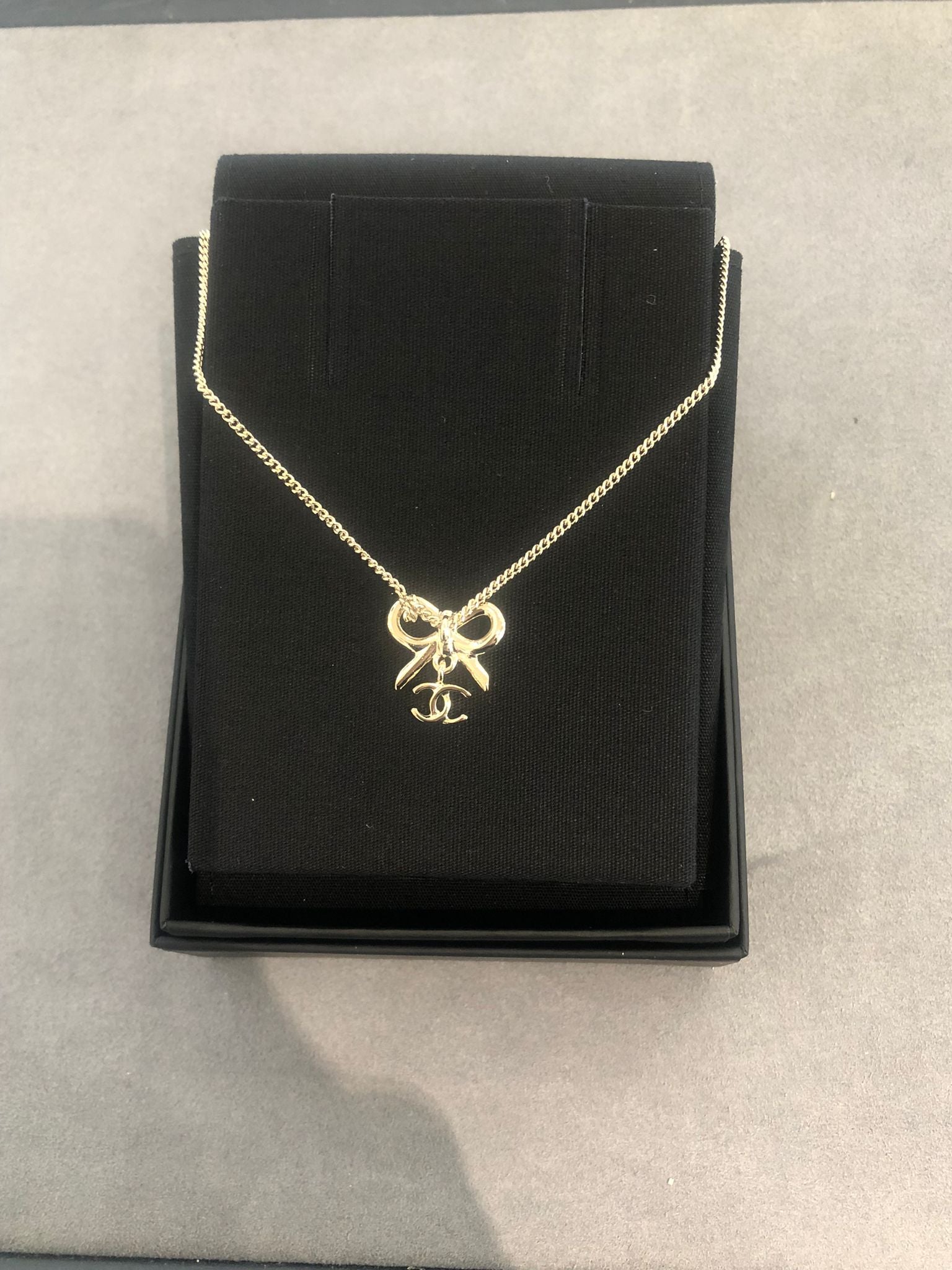 Hong Kong Stock - Chanel 25K Bow and Dangling Logo Necklace in SHW ABG556