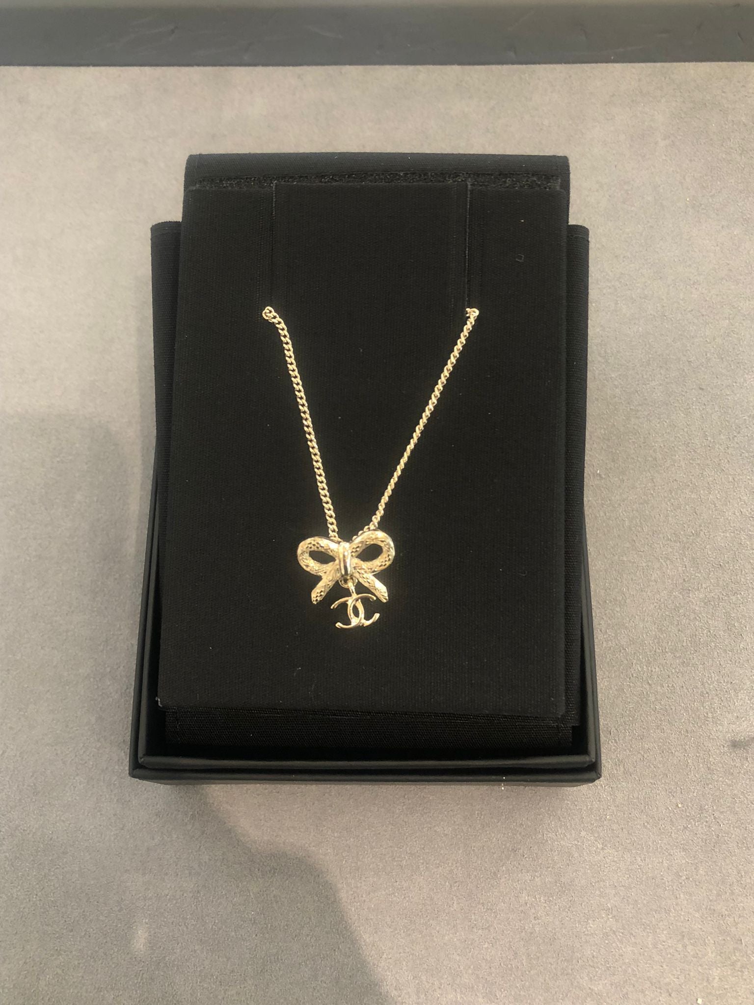 Hong Kong Stock - Chanel 25K Bow and Dangling Logo Necklace in SHW ABG556